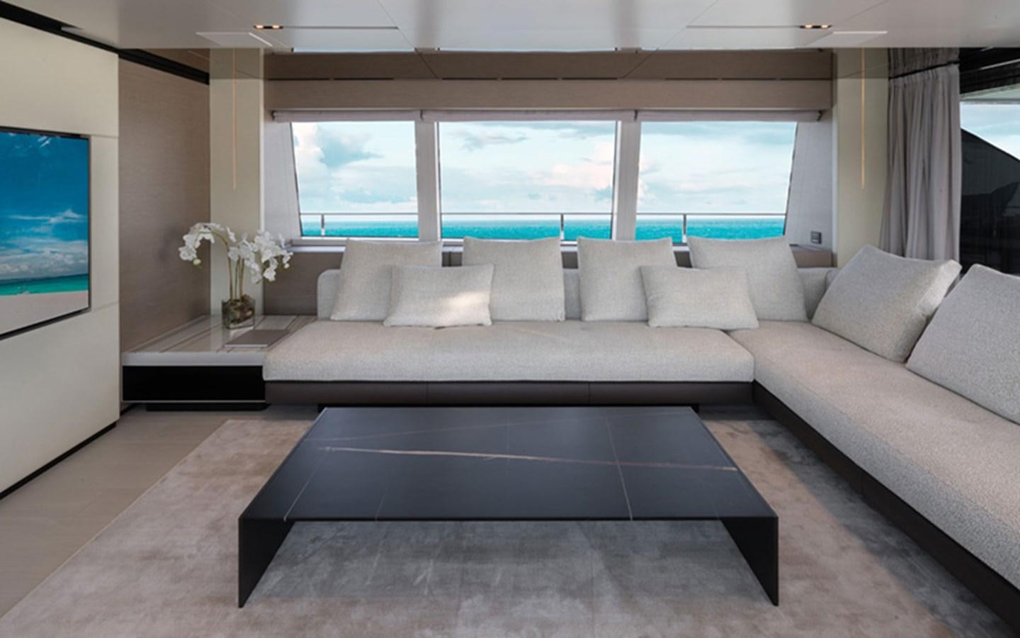 a large living room with a large window aboard ADELIA Yacht for Sale