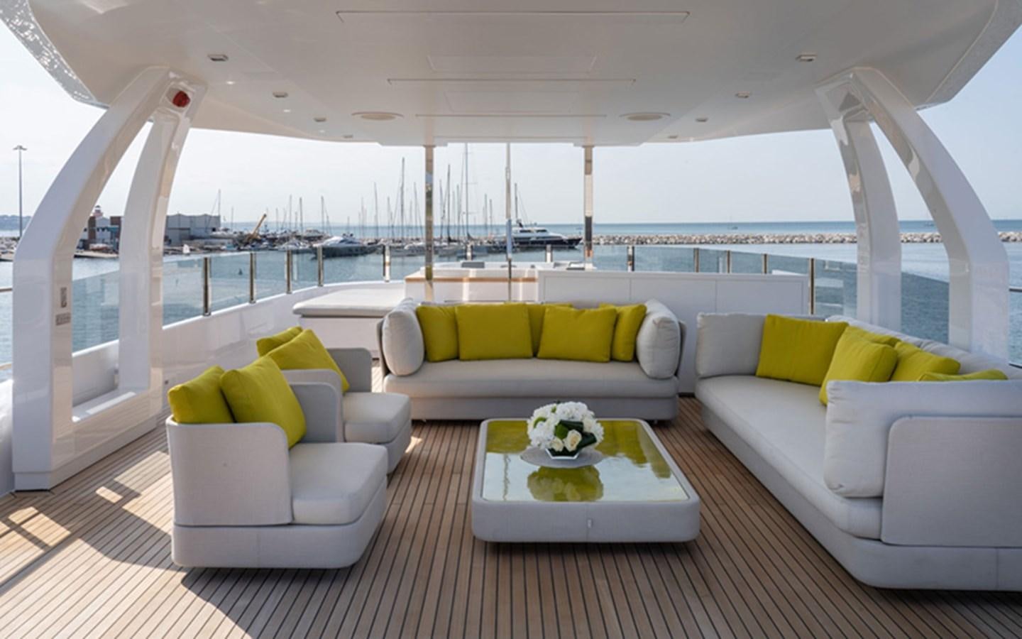a living room with a large balcony aboard ADELIA Yacht for Sale