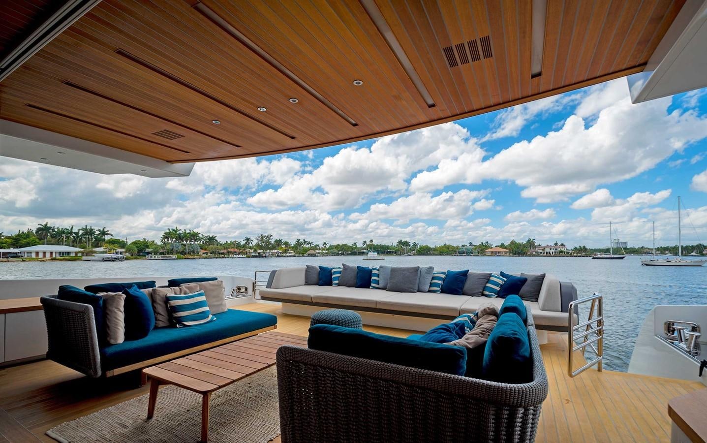 a patio with a large body of water and a large blue sky aboard CYRA Yacht for Sale