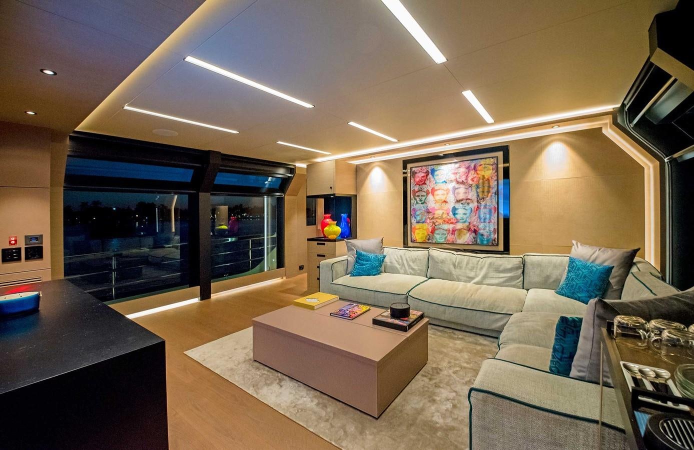 a living room with a large window aboard CYRA Yacht for Sale
