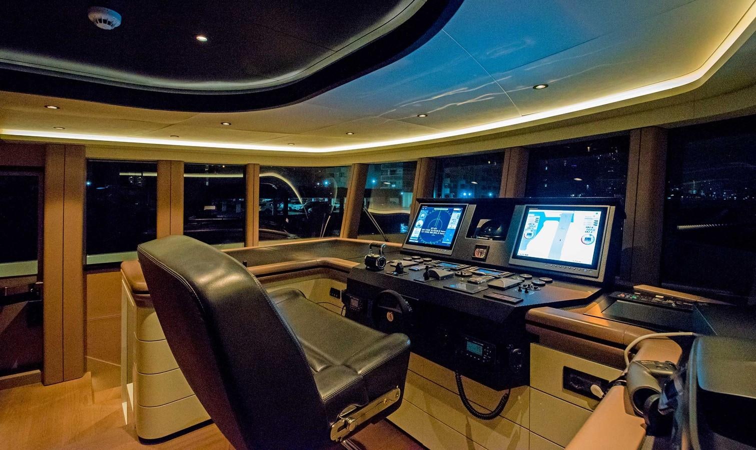 a room with computers and monitors aboard CYRA Yacht for Sale