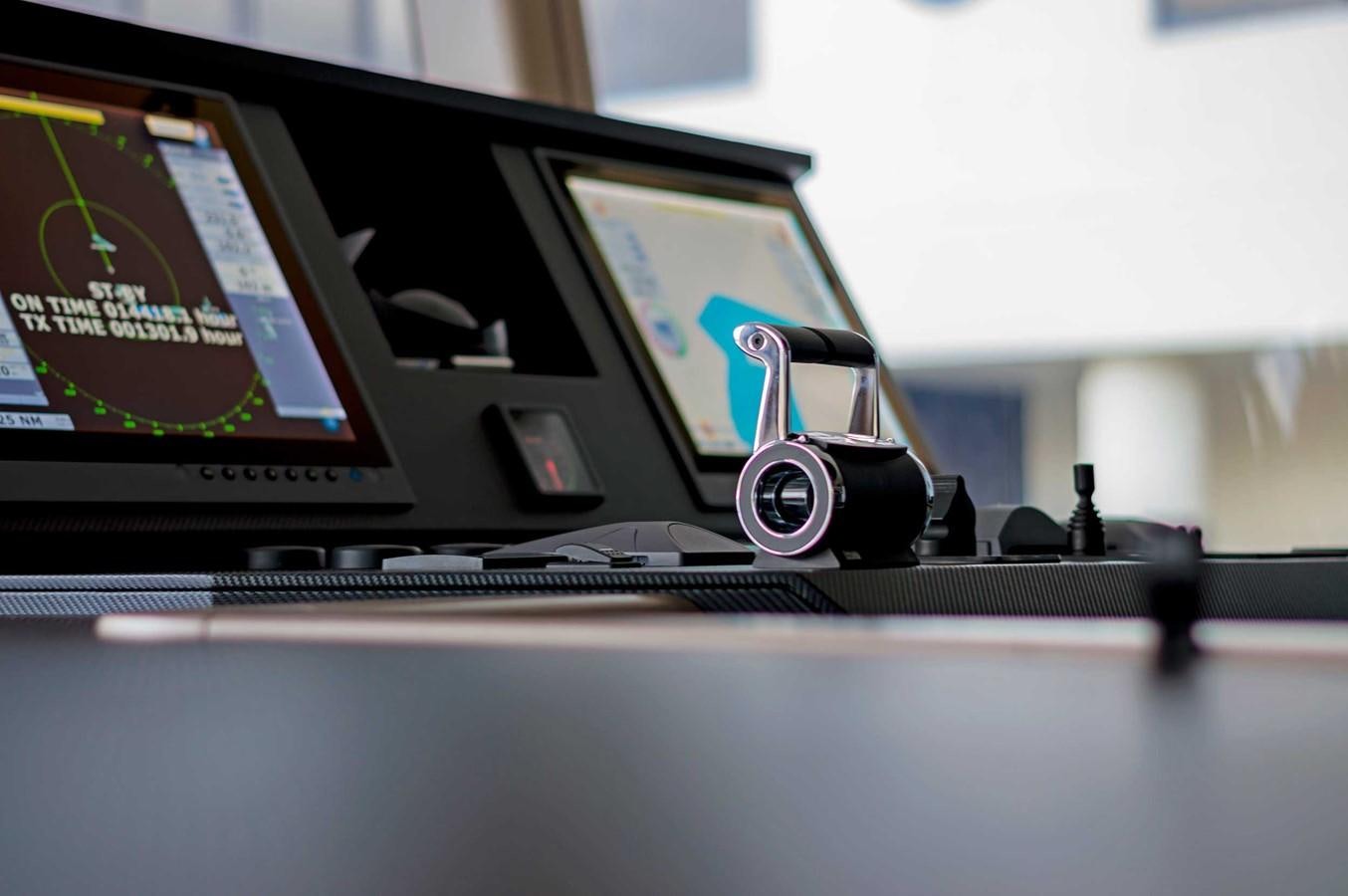 a laptop with a headset on aboard CYRA Yacht for Sale