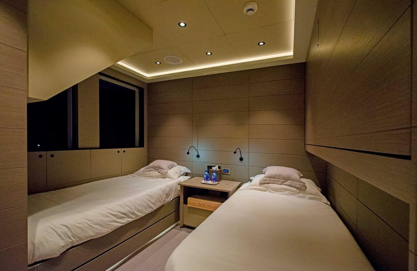 a room with two beds aboard CYRA Yacht for Sale