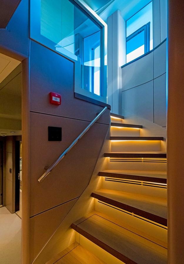a flight of stairs in a room aboard CYRA Yacht for Sale