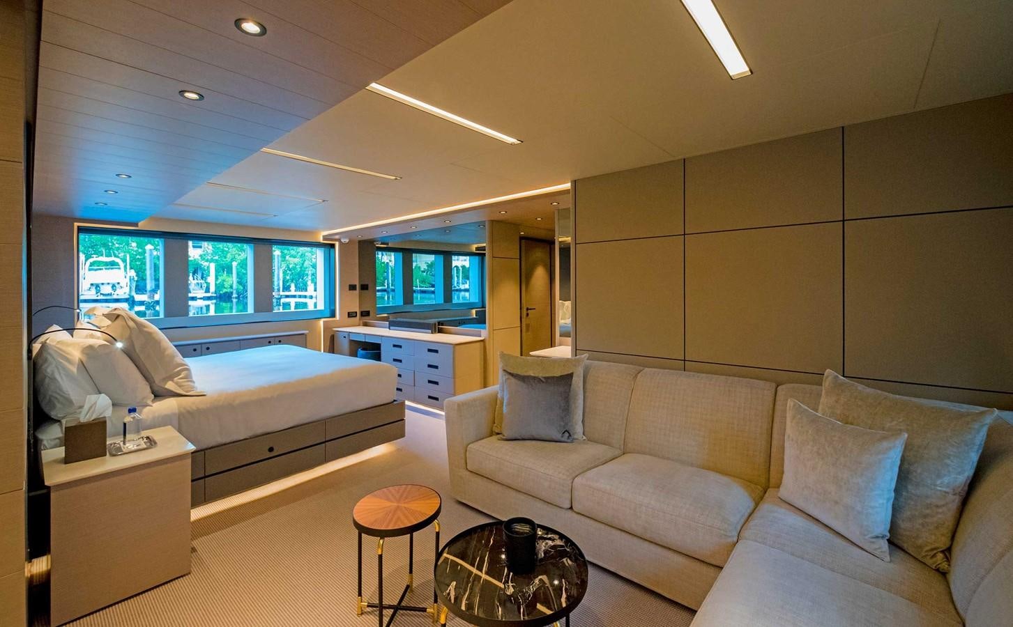 a living room with a couch and a tv aboard CYRA Yacht for Sale