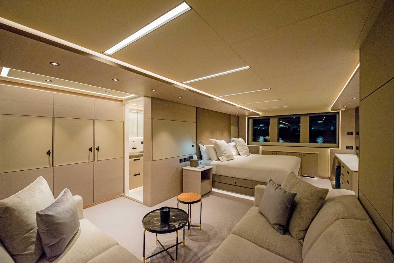 a living room with a couch and a television aboard CYRA Yacht for Sale