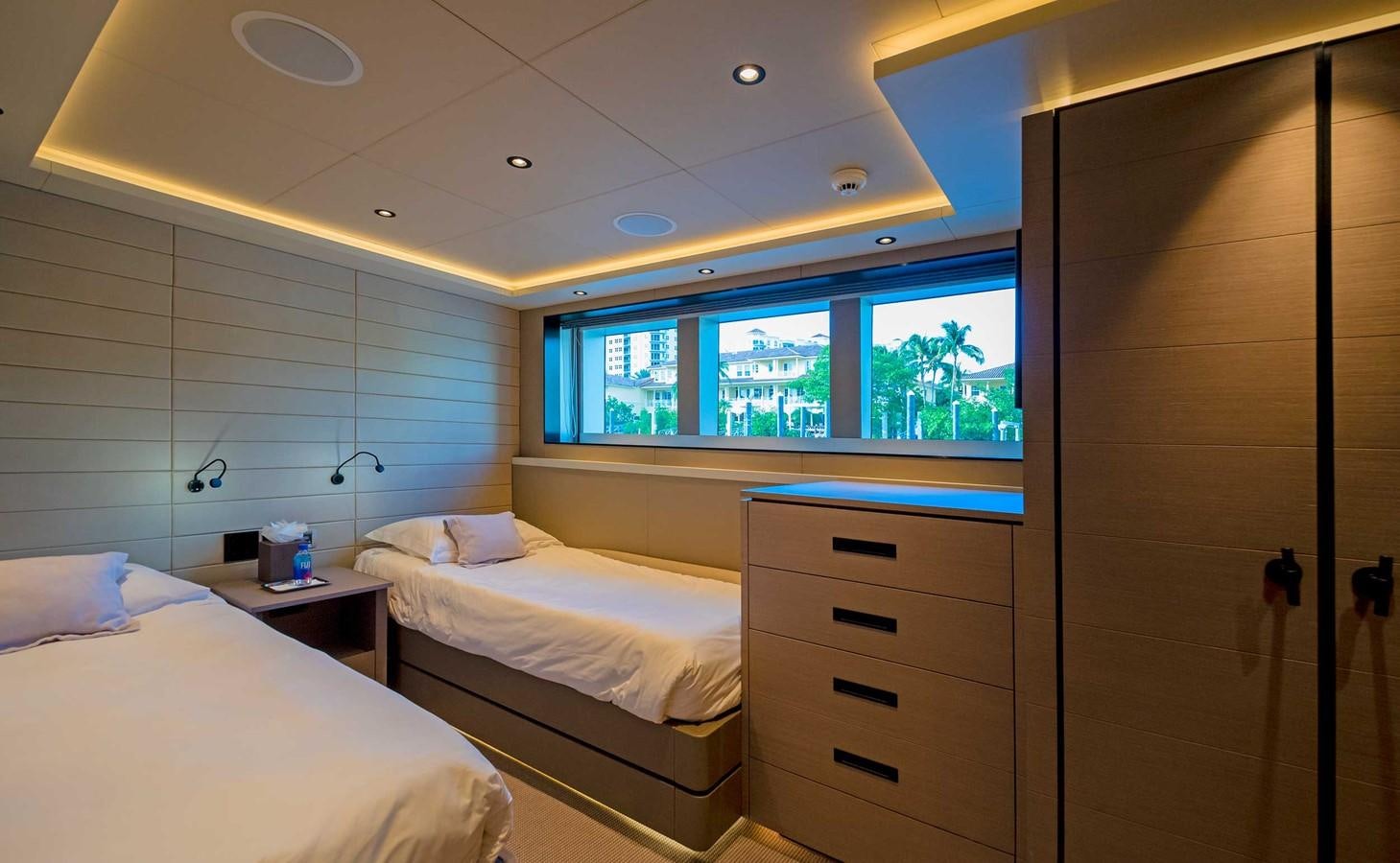 a room with two beds aboard CYRA Yacht for Sale