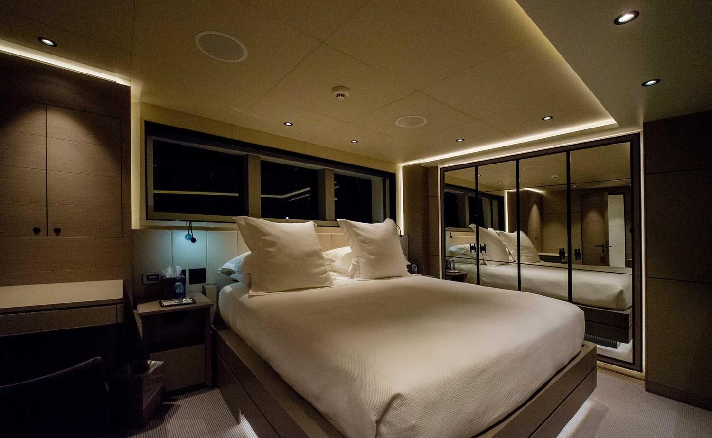 a bed in a room aboard CYRA Yacht for Sale