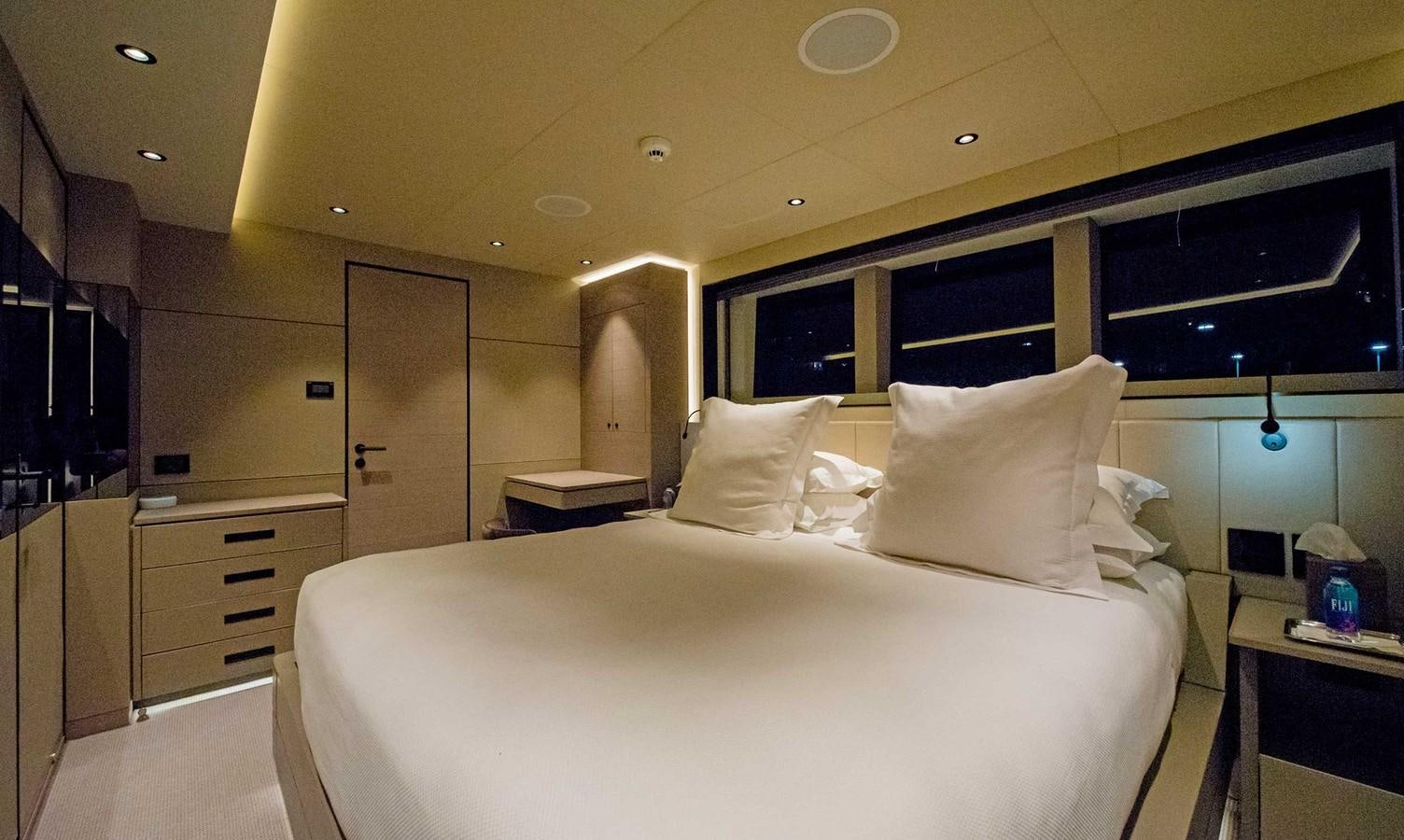 a large bed in a room aboard CYRA Yacht for Sale