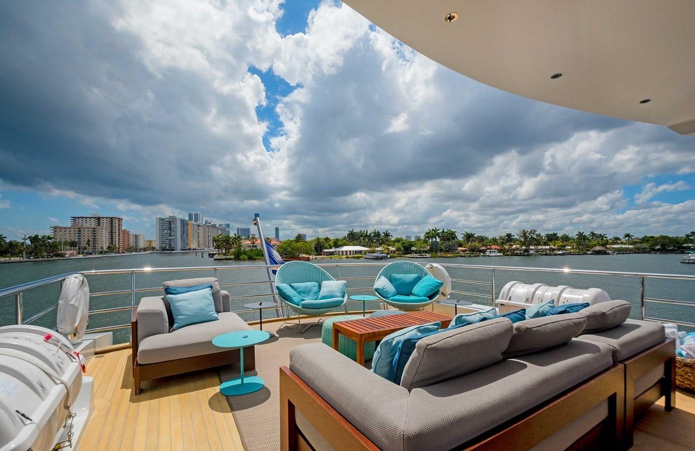 a room with a couch and a pool aboard CYRA Yacht for Sale