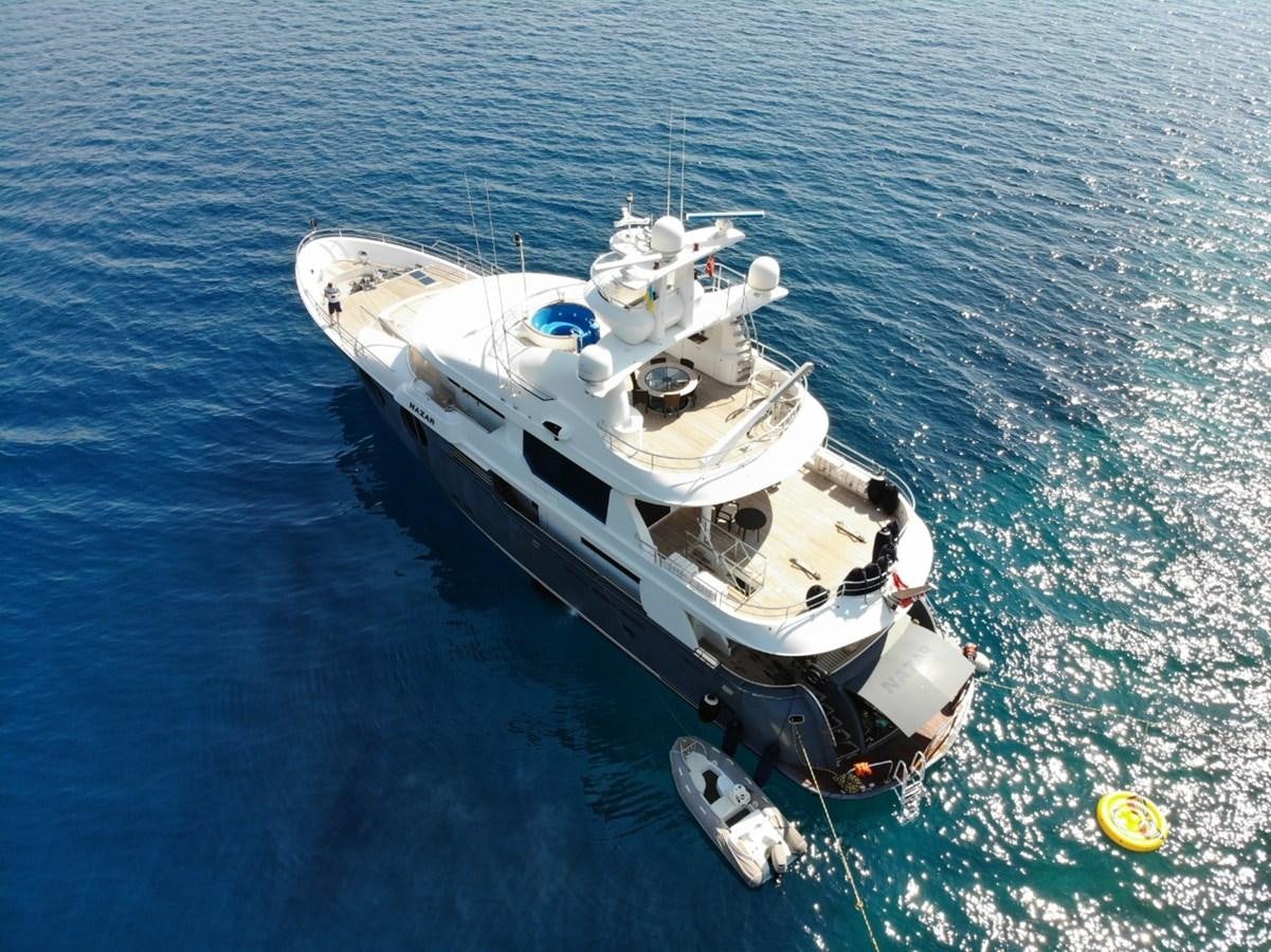 a white boat in the water aboard NAZAR Yacht for Sale