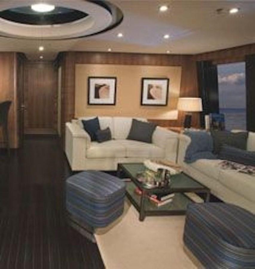 a living room with a couch and a coffee table aboard NAZAR Yacht for Sale