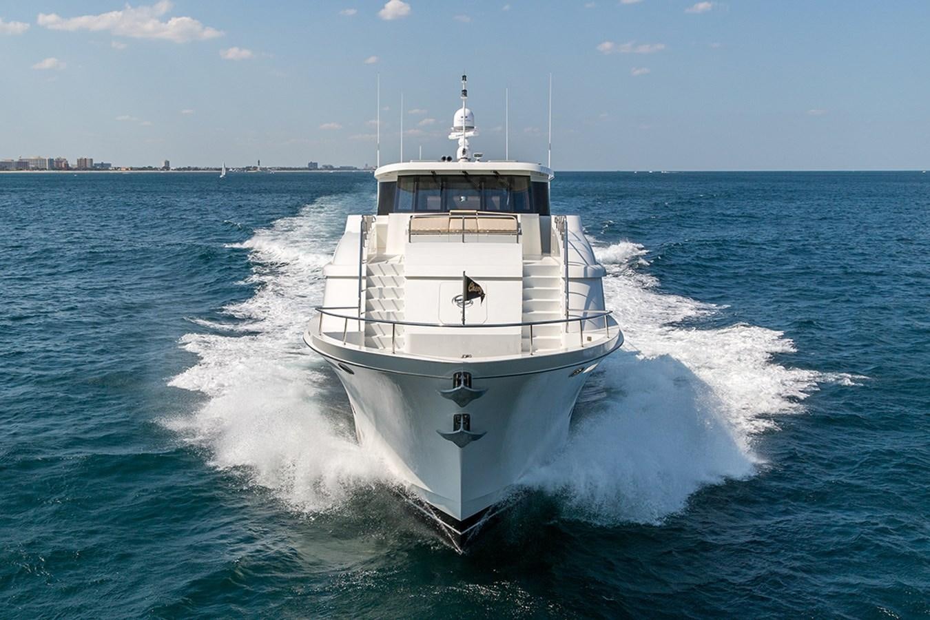 a large white boat on the water aboard OUR TRADE Yacht for Sale