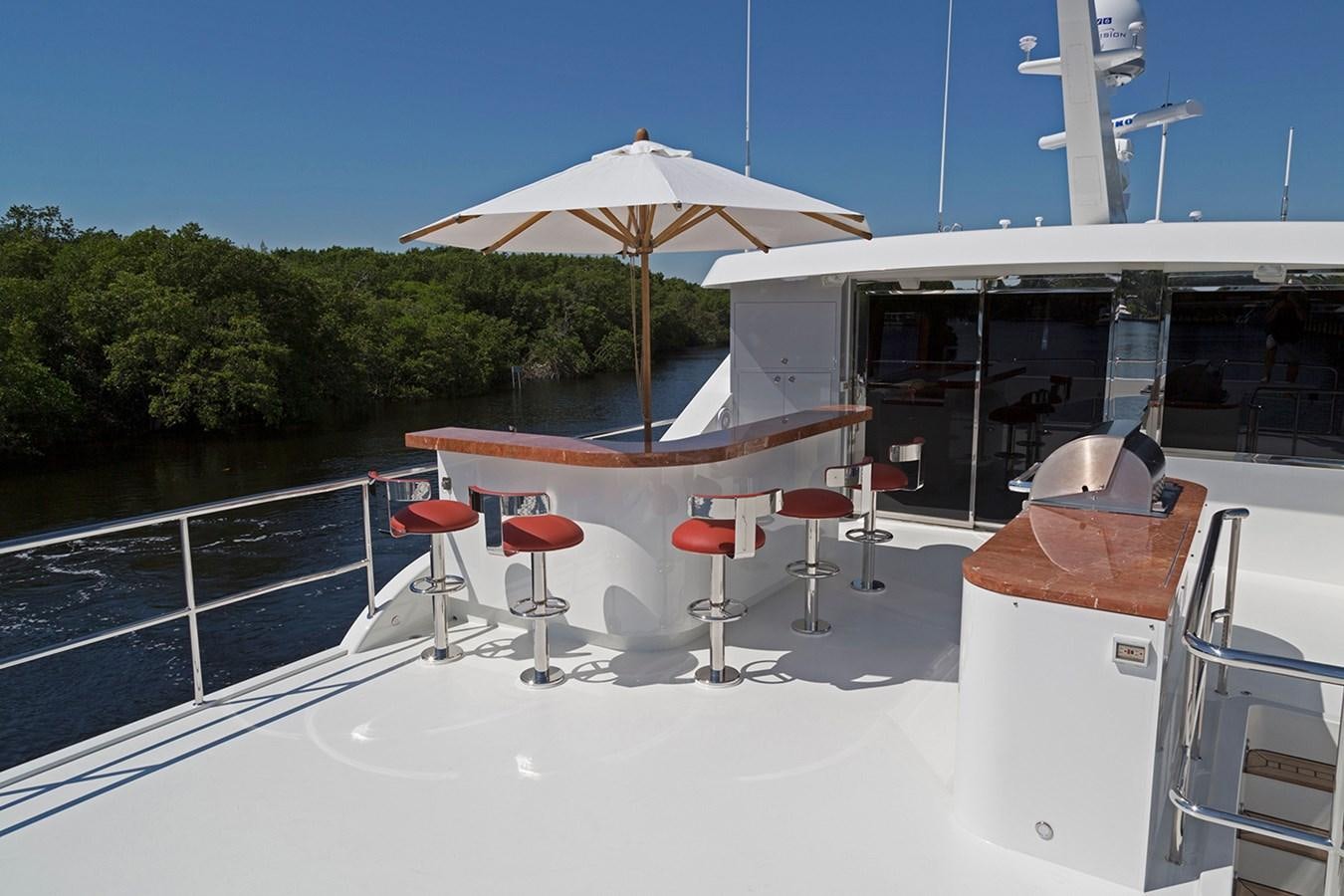 a boat with tables and chairs on it aboard OUR TRADE Yacht for Sale