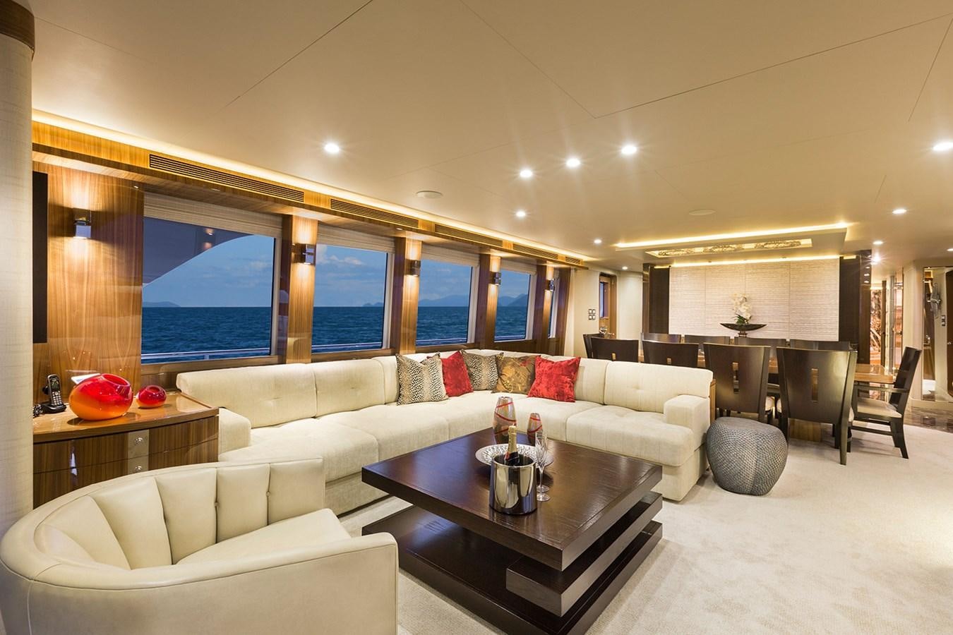a living room with a large window aboard OUR TRADE Yacht for Sale