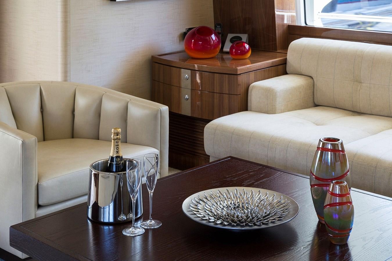 a table with a plate of food and glasses on it aboard OUR TRADE Yacht for Sale