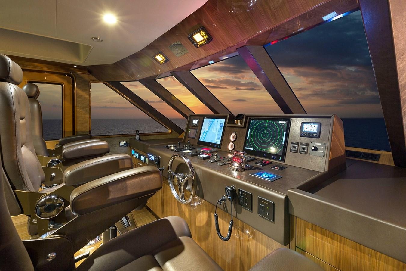 inside of a vehicle with a screen and speakers aboard OUR TRADE Yacht for Sale