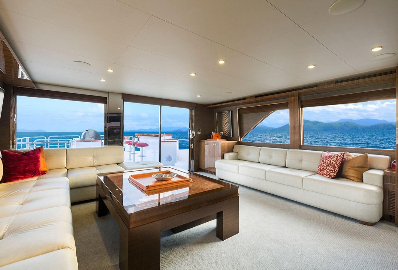 a living room with a large window aboard OUR TRADE Yacht for Sale