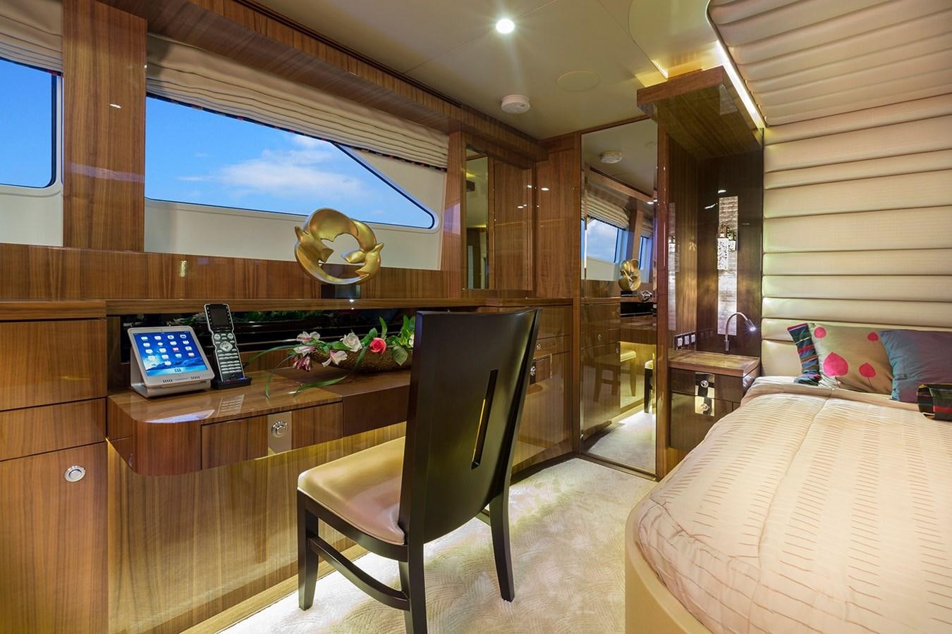 a bedroom with a desk and a bed aboard OUR TRADE Yacht for Sale
