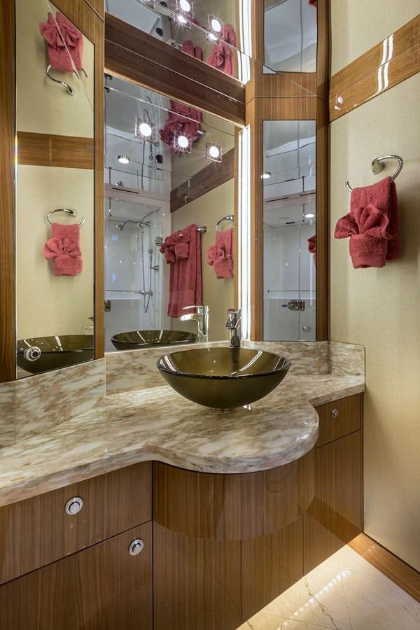 a bathroom with a large mirror aboard OUR TRADE Yacht for Sale