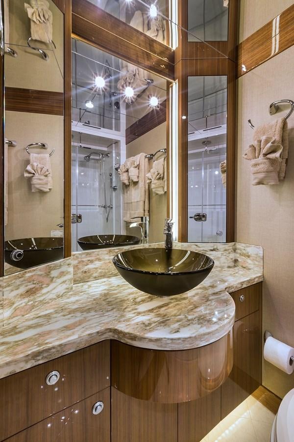 a bathroom with a large mirror aboard OUR TRADE Yacht for Sale