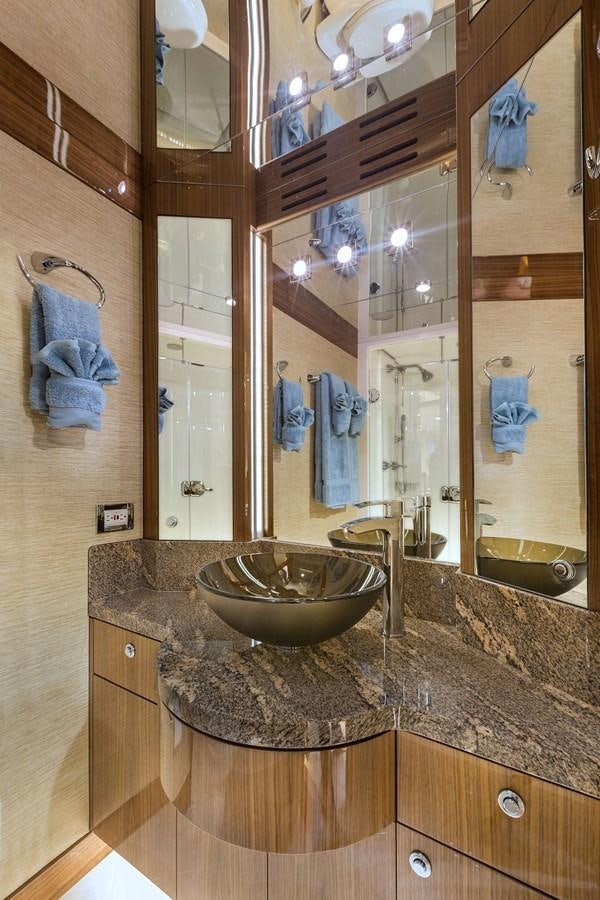 a bathroom with a large mirror aboard OUR TRADE Yacht for Sale