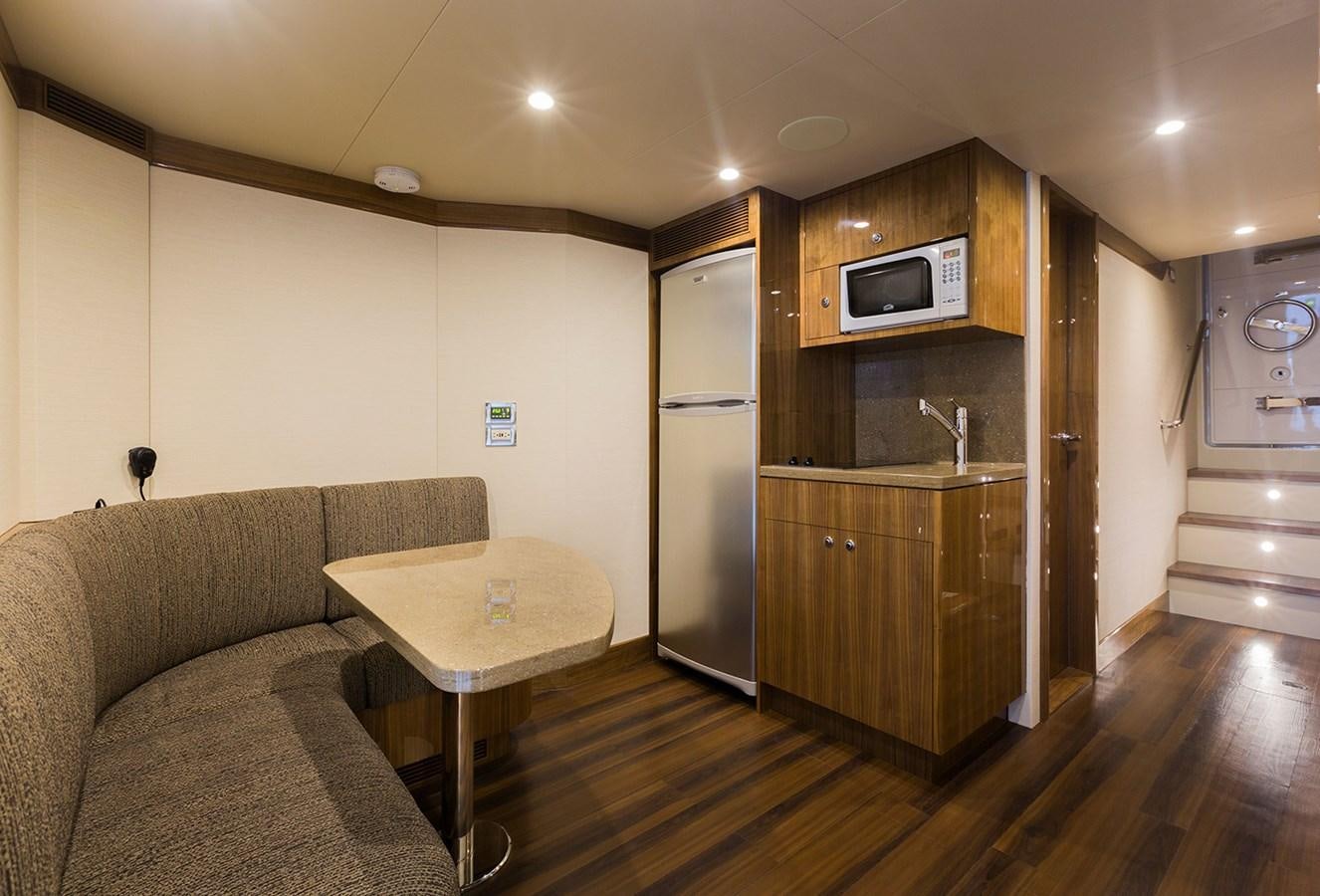 a living room with a couch and a table aboard OUR TRADE Yacht for Sale