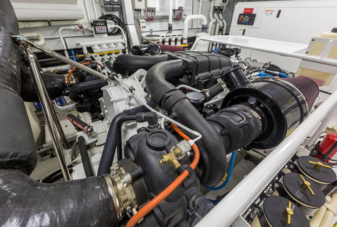 a car engine with a black hood aboard OUR TRADE Yacht for Sale