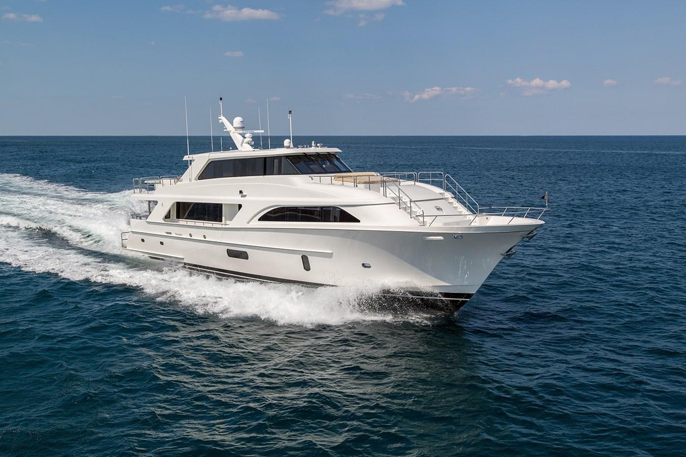 a white yacht on the water aboard OUR TRADE Yacht for Sale