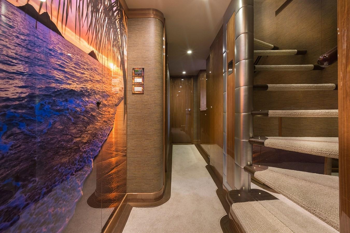a staircase with a large mural aboard OUR TRADE Yacht for Sale