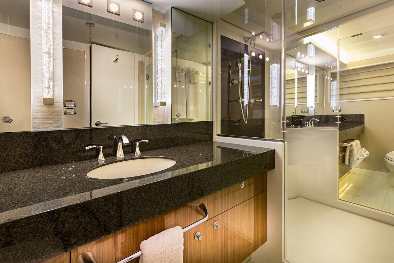 a bathroom with a large mirror aboard OUR TRADE Yacht for Sale