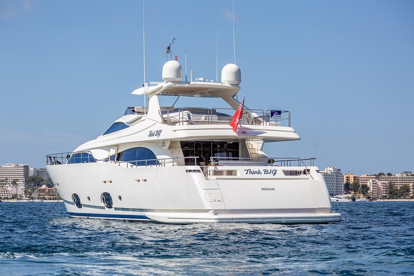 a white boat in the water aboard THINK BIG Yacht for Sale
