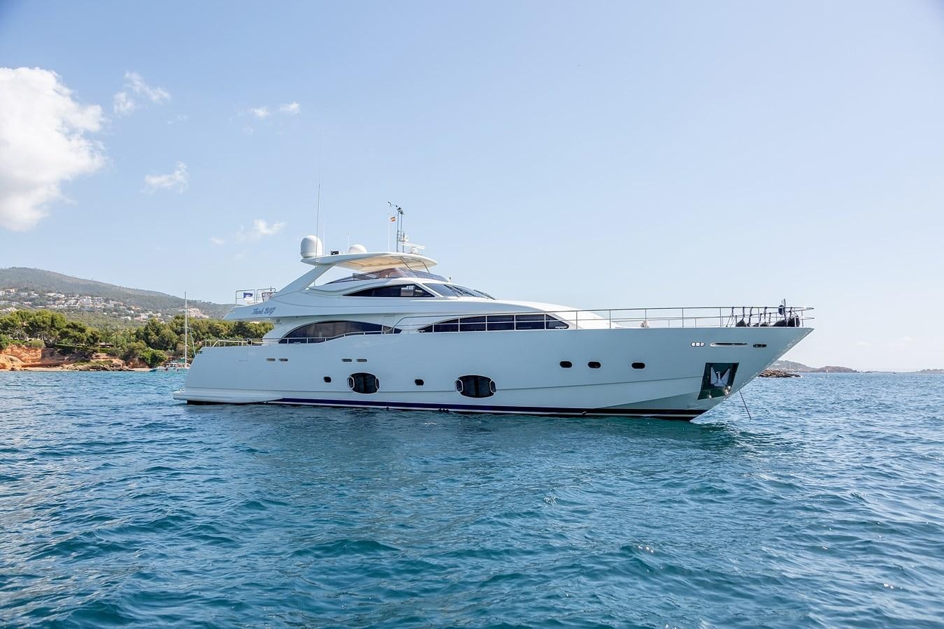 a white yacht on the water aboard THINK BIG Yacht for Sale