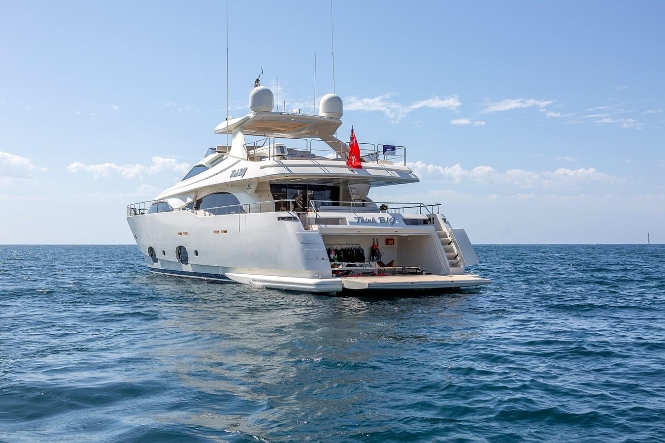 a white boat in the water aboard THINK BIG Yacht for Sale