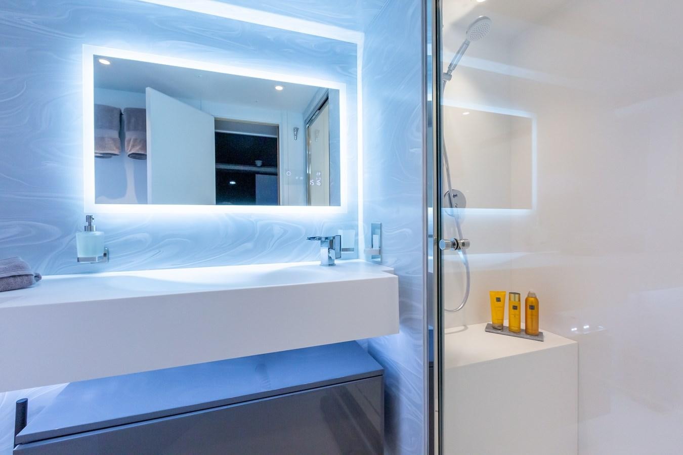 a bathroom with a large mirror aboard THINK BIG Yacht for Sale