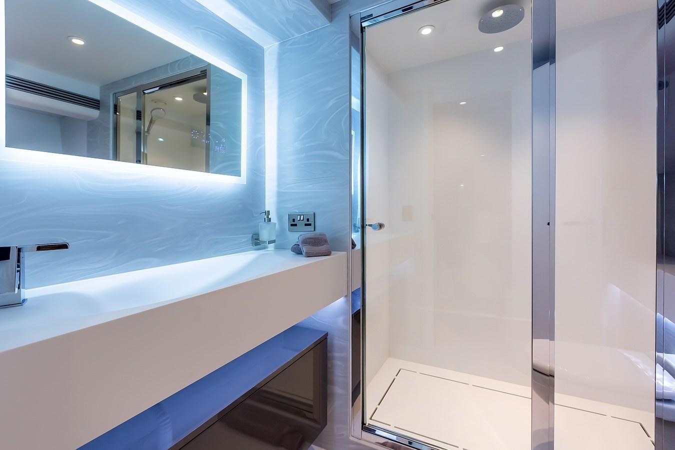 a bathroom with a tub and a shower aboard THINK BIG Yacht for Sale