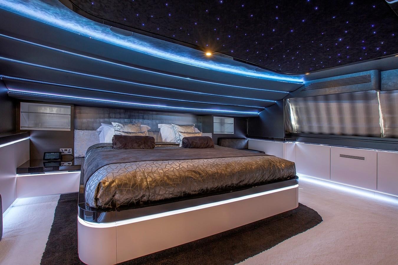 a bed in a room aboard THINK BIG Yacht for Sale