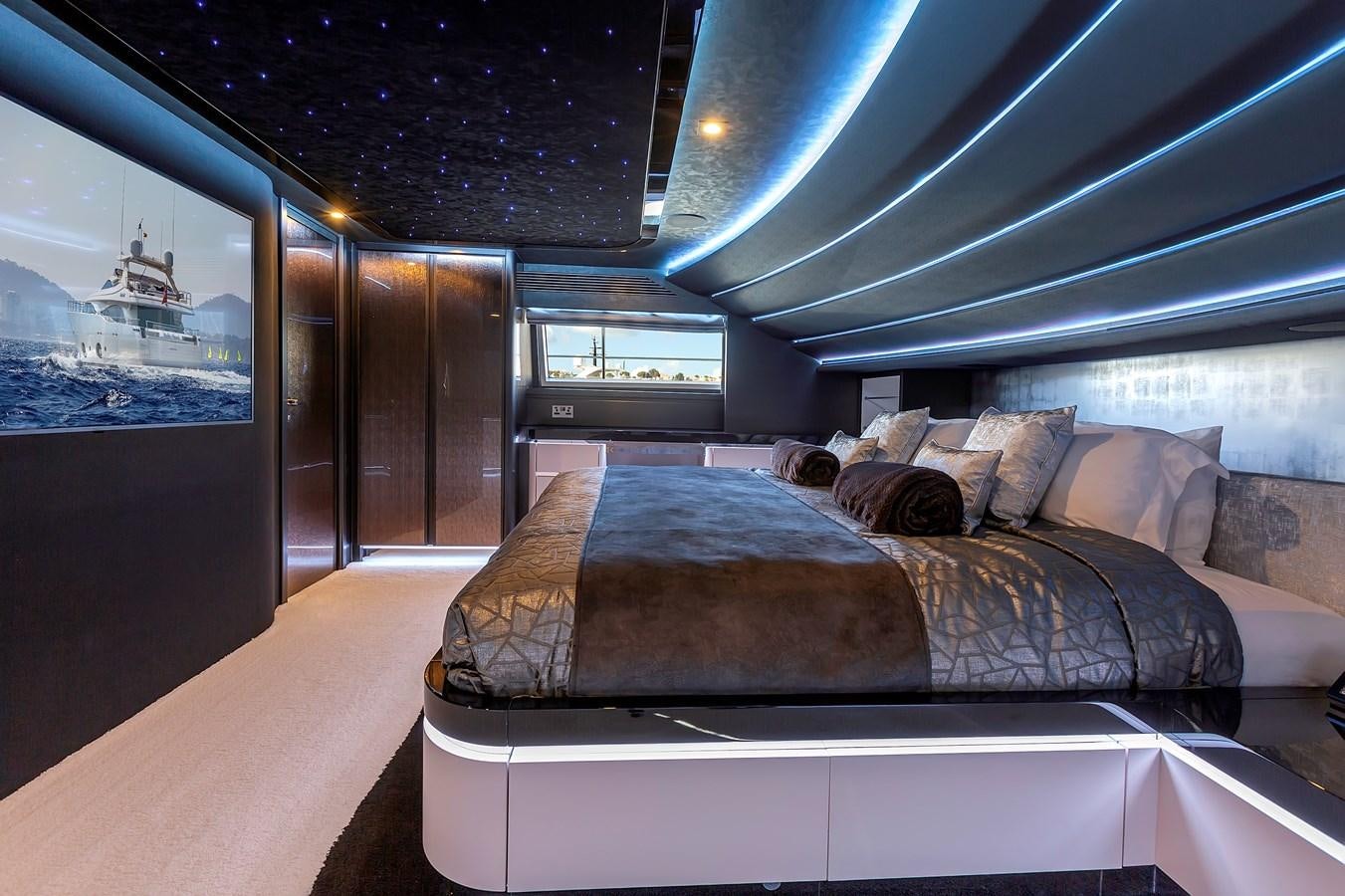 a bed in a room aboard THINK BIG Yacht for Sale