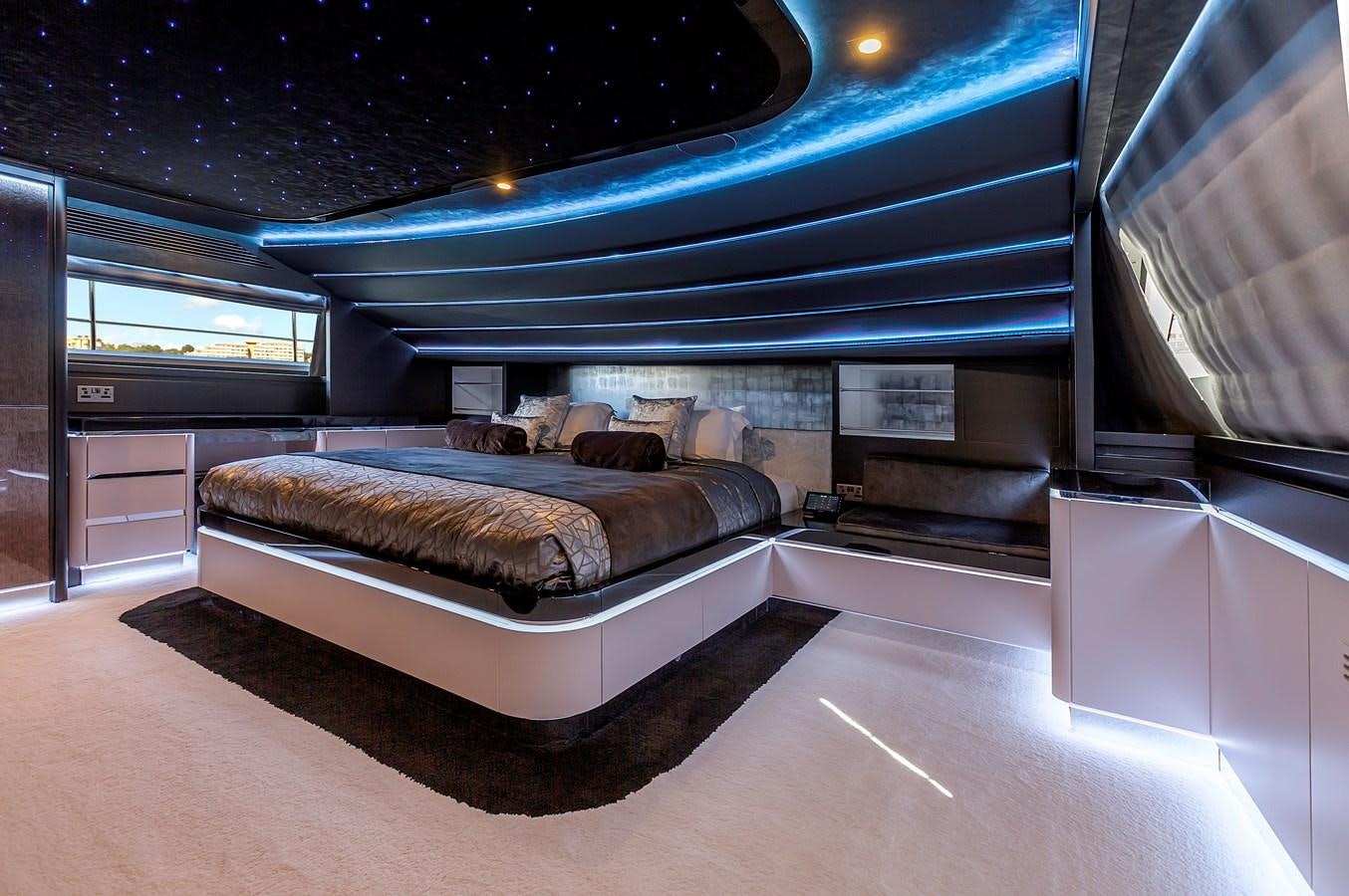 a bed in a room aboard THINK BIG Yacht for Sale