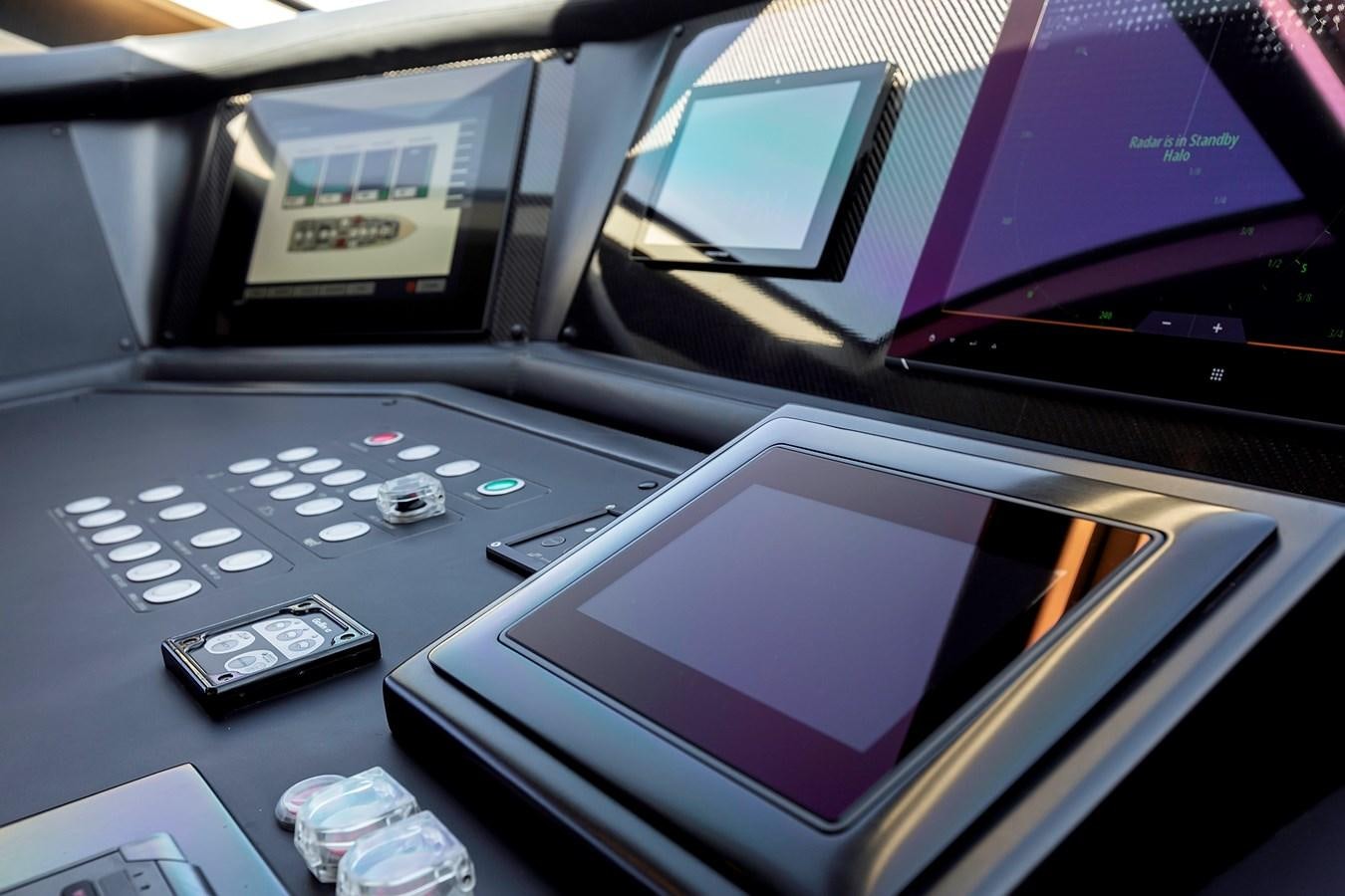 a group of cell phones in a car aboard THINK BIG Yacht for Sale