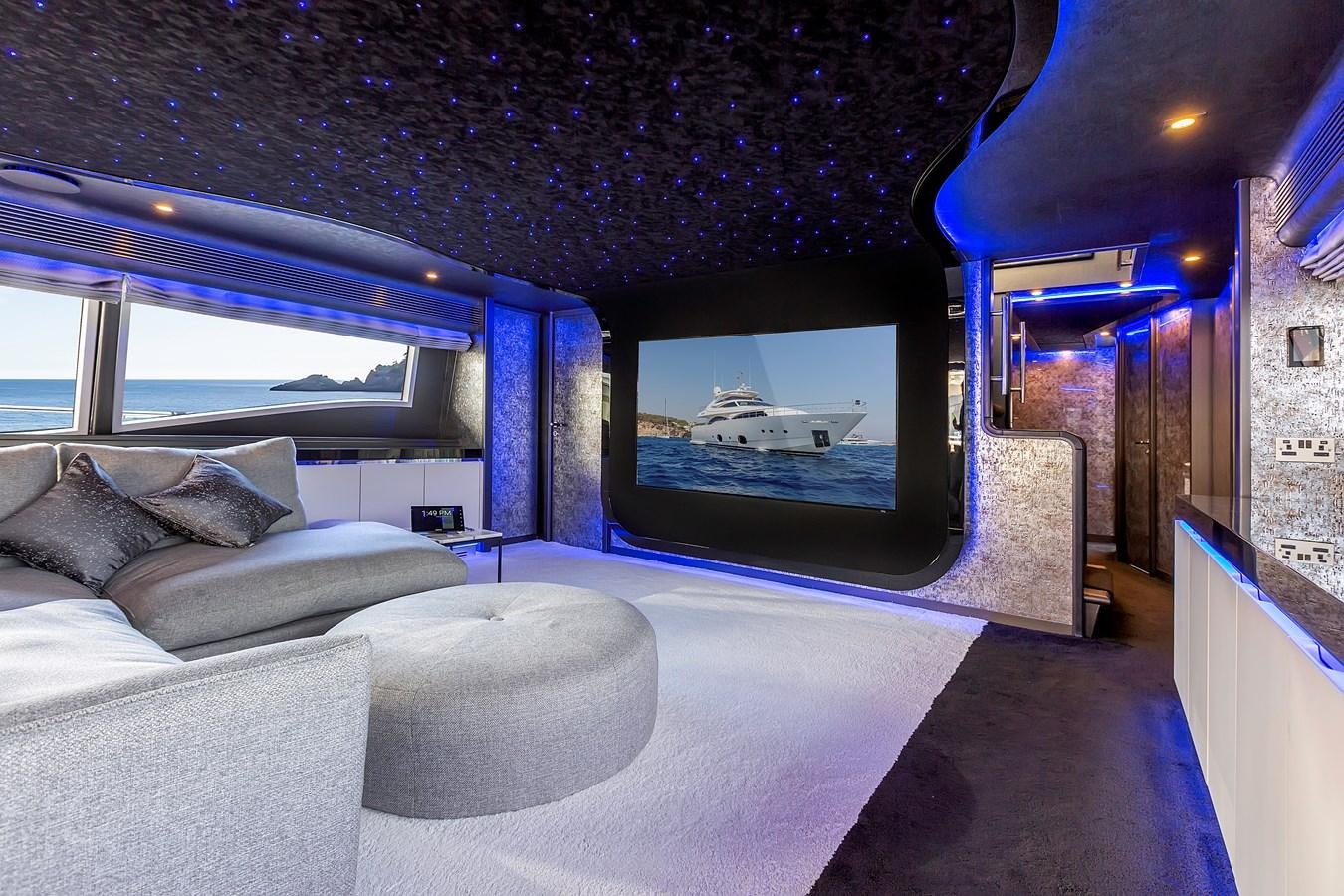 a room with a bed and a window aboard THINK BIG Yacht for Sale