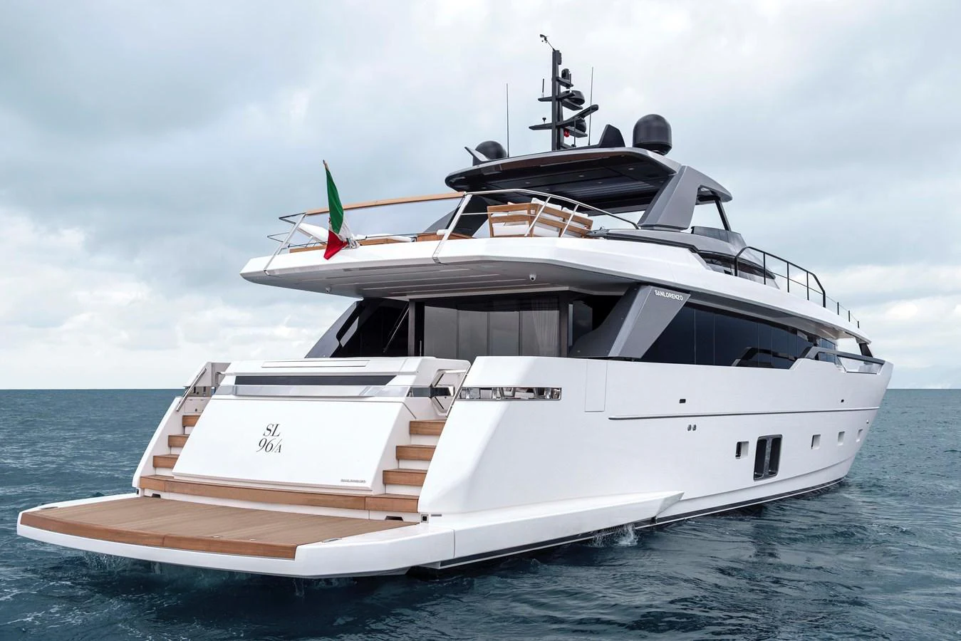 a white boat in the water aboard INVICTUS Yacht for Sale
