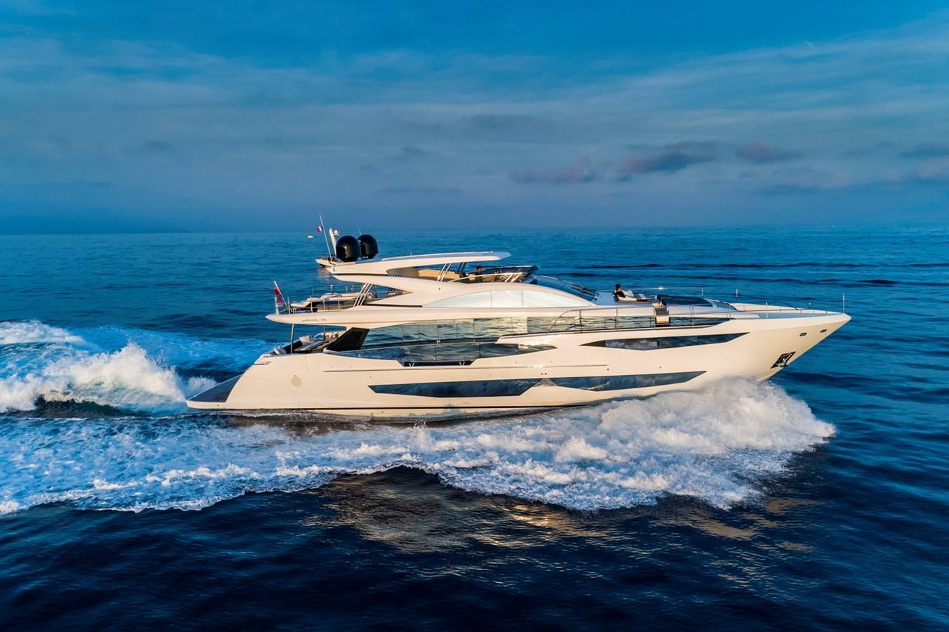 a white yacht on the water aboard PEARL Yacht for Sale