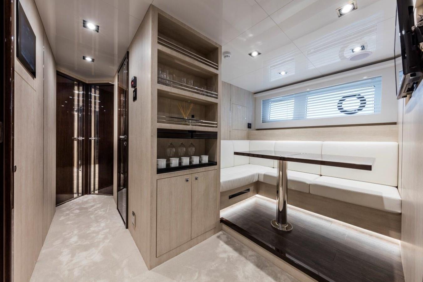 a room with a desk and a bed aboard PEARL Yacht for Sale