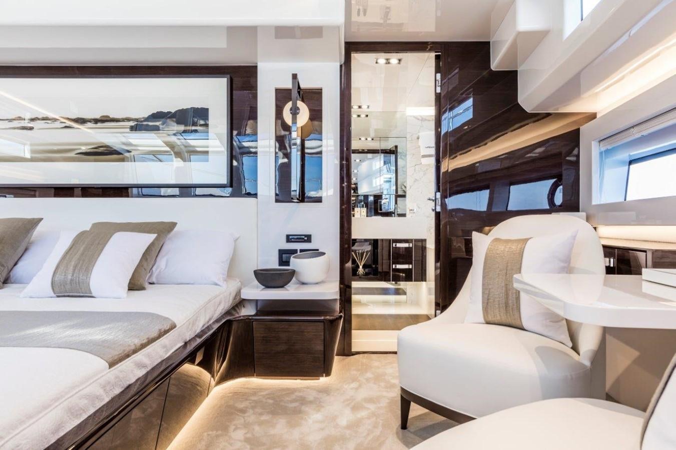 a room with a bed and a couch aboard PEARL Yacht for Sale