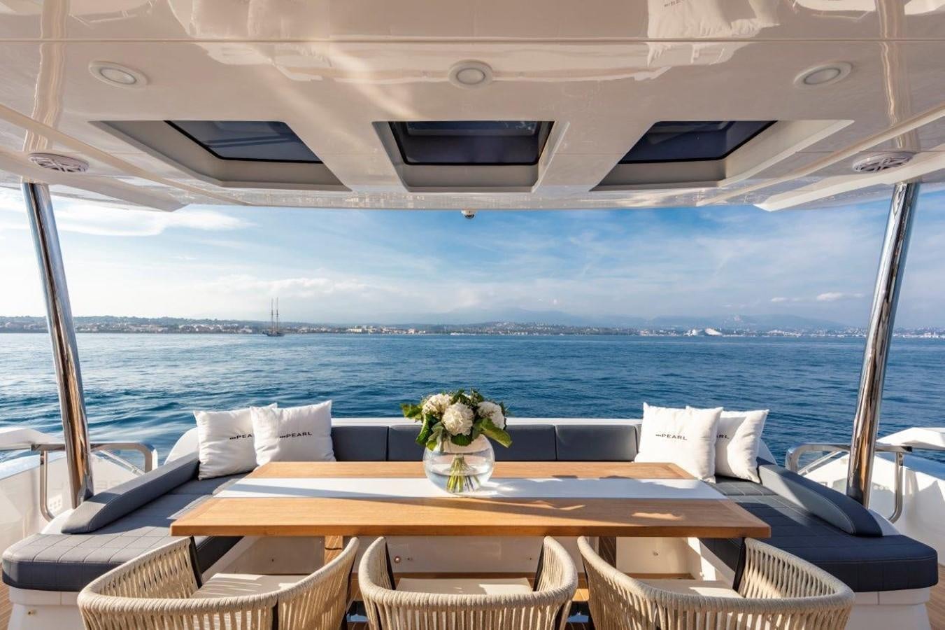 a table on a boat aboard PEARL Yacht for Sale