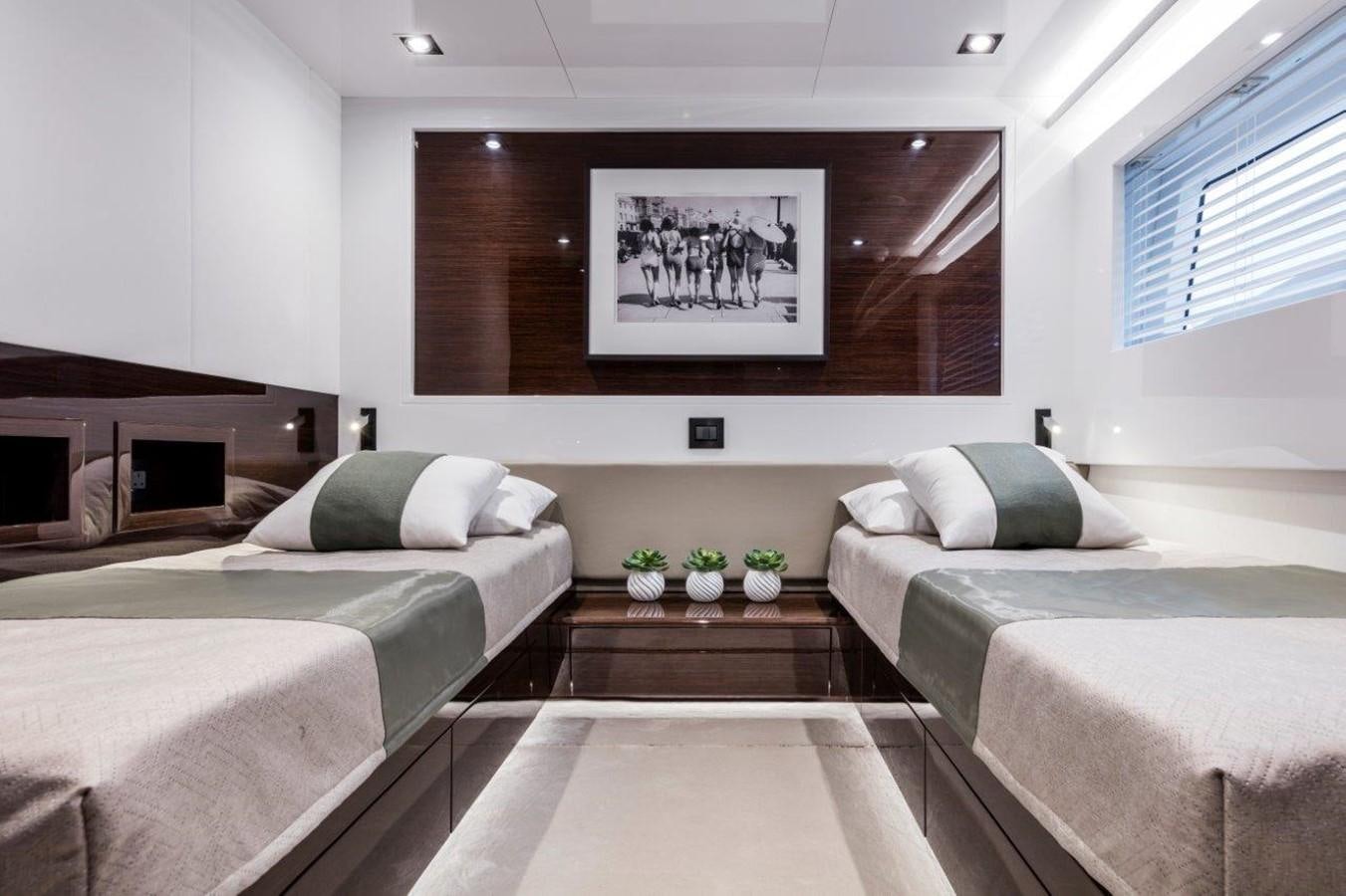 a room with two beds aboard PEARL Yacht for Sale