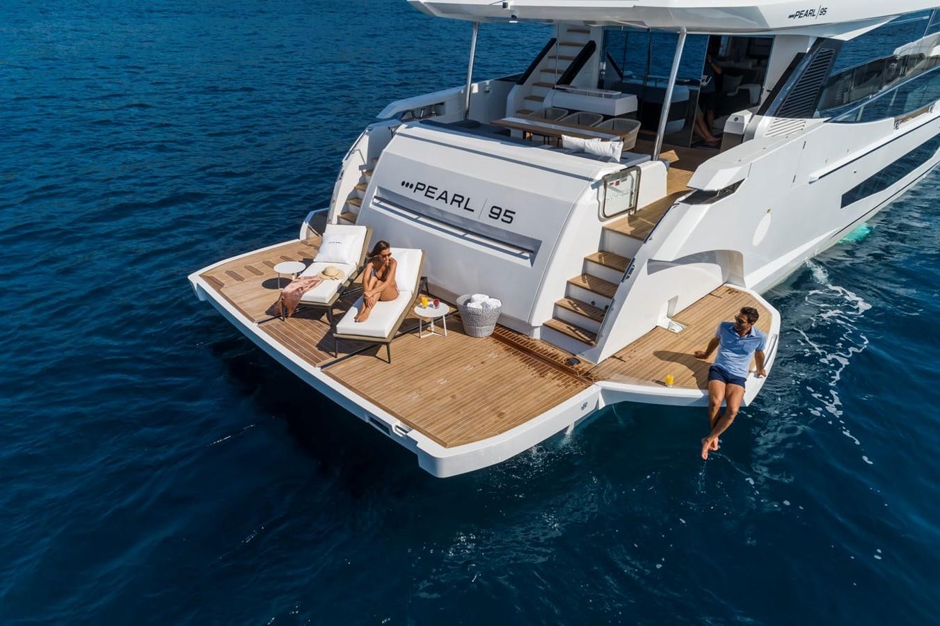 a man and a woman on a boat aboard PEARL Yacht for Sale