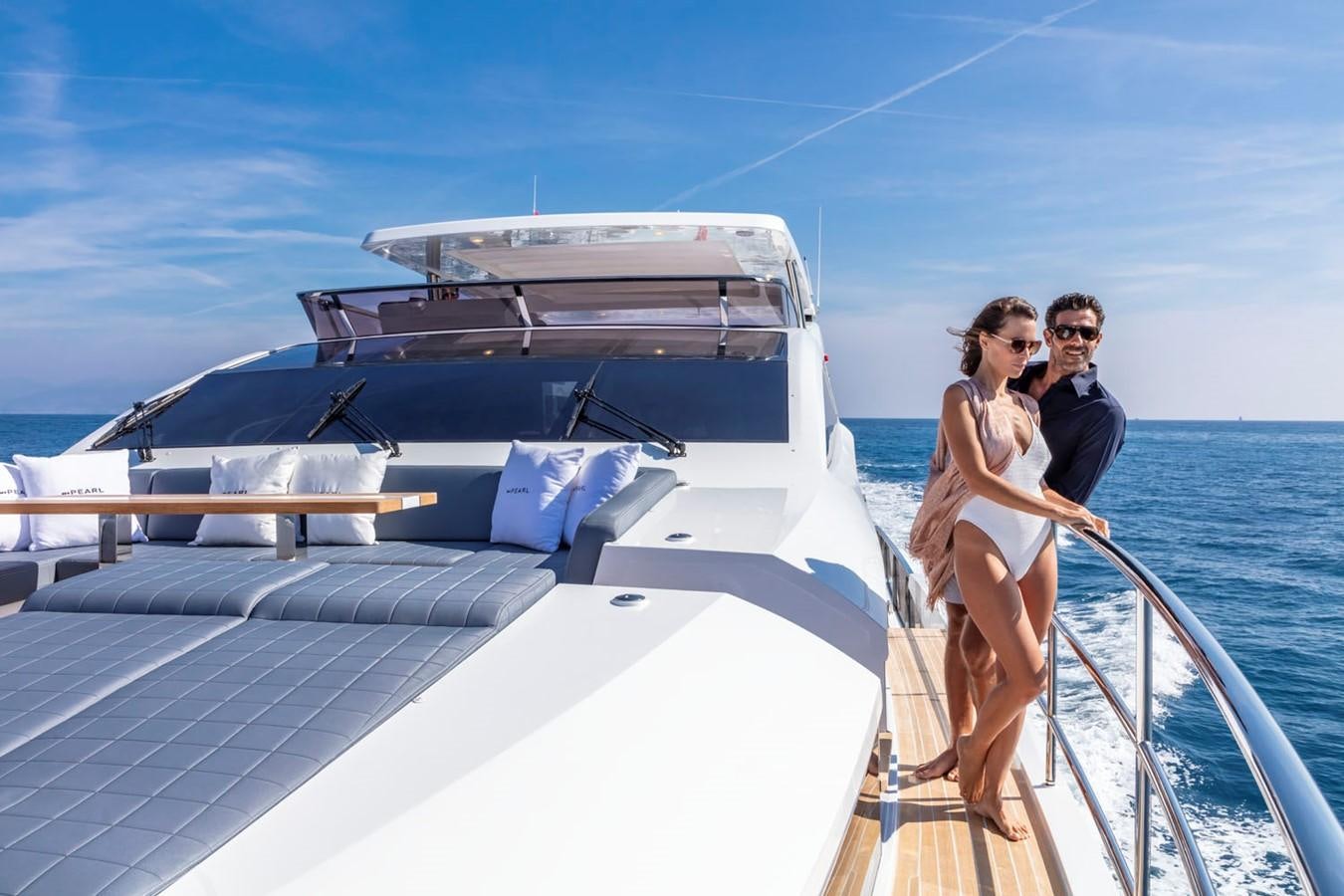 a man and woman kissing on a boat aboard PEARL Yacht for Sale