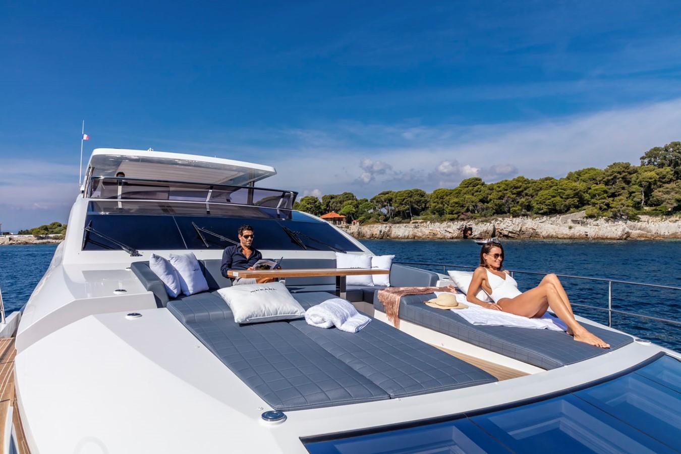 a group of people sitting on a boat aboard PEARL Yacht for Sale